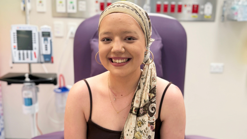 Young woman wearing a head scarf attending an appointment