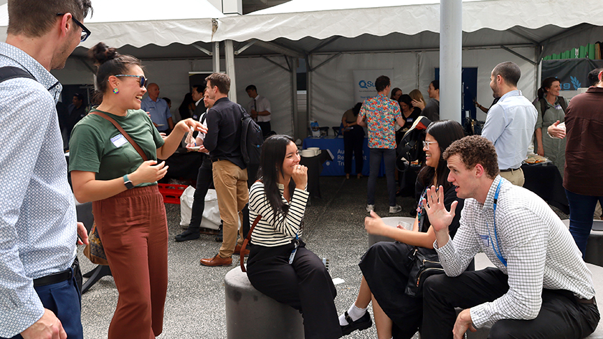 Group of healthcare staff chatting at a conference
