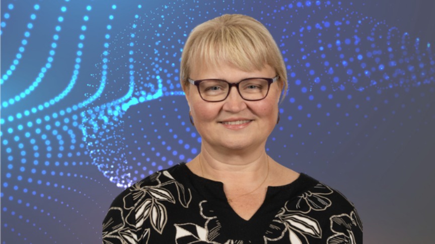 Headshot of woman on blue background