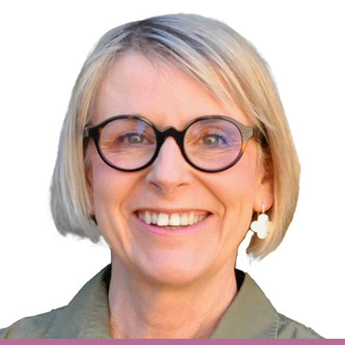 A person with blonde short hair wearing glasses, shown from the shoulders up against a white background.