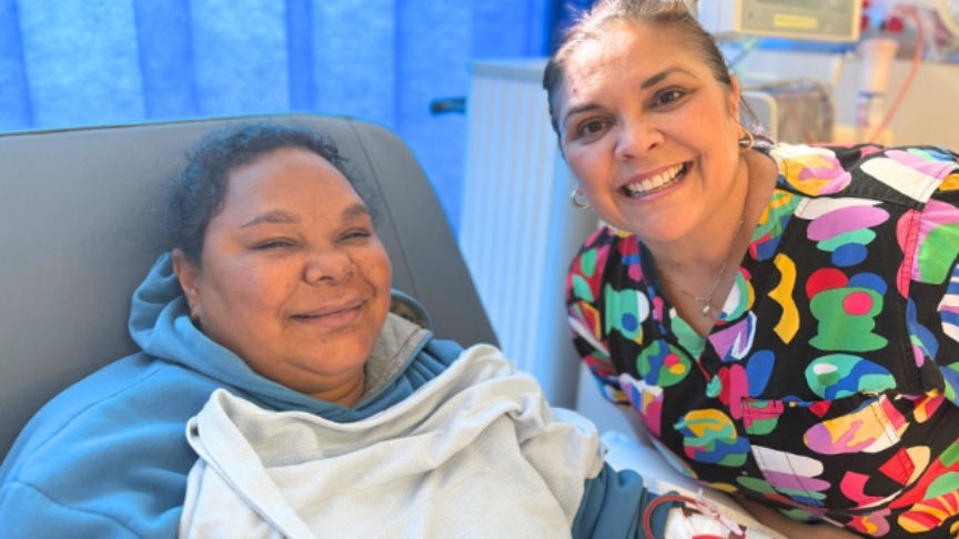 Indigenous lady smiling with nurse 