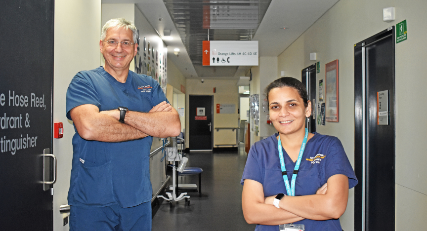 Professor Gerald Holtmann and Dr. Ayesha Shah stand in a hallway at PA Hospital