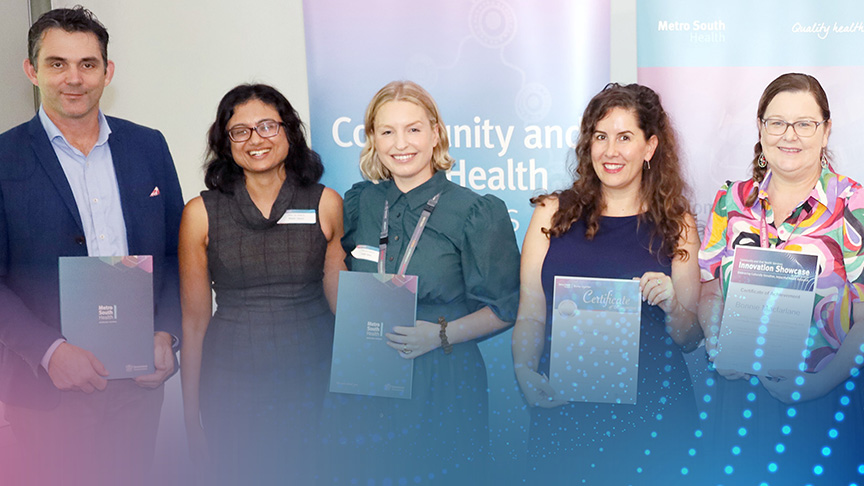 A group of people receiving an award at an event