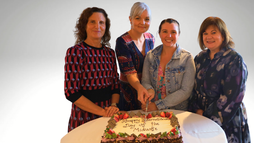 Group of nurses with celebration cake
