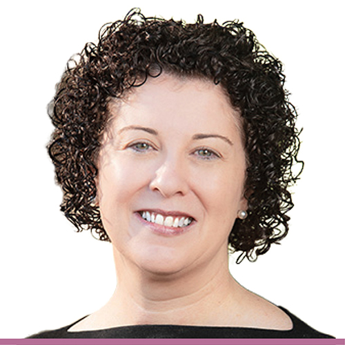 A person with short, dark curly hair wearing a black top.