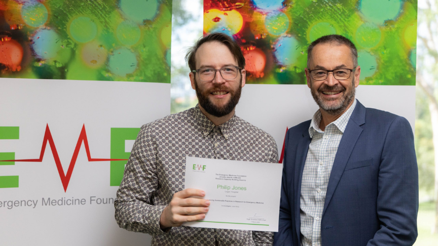 Doctor receiving a certificate from an official