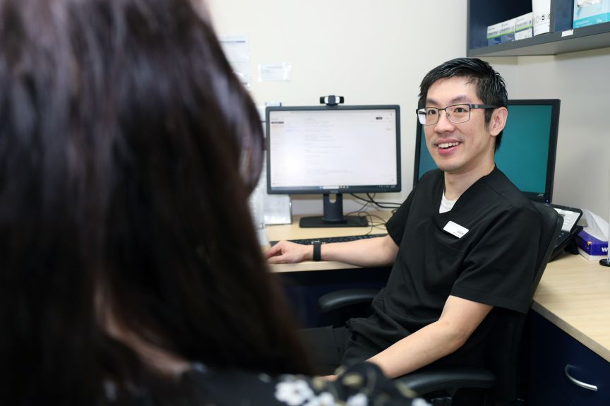 A clinician consult with a patient in the outpatient setting using Ambient AI scribe assist