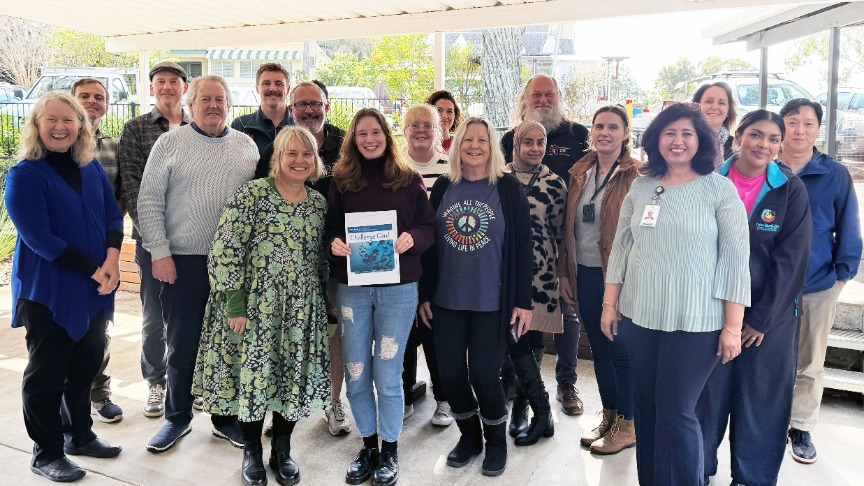 A diverse group of mental health service providers proudly holding a certificate at the Challenge Card workshop