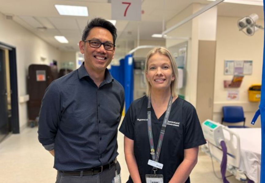 Photograph of male and female clinicians smiling in the Emergency Department