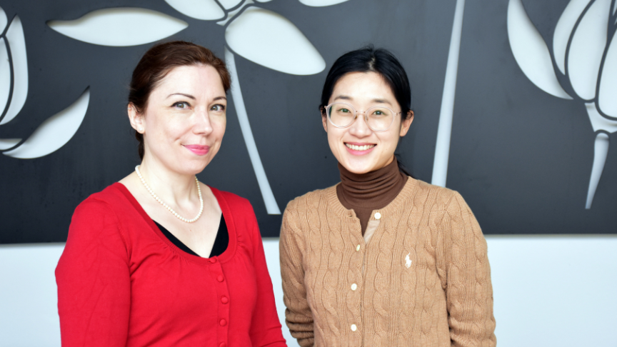Two nurses standing outside in plain clothes