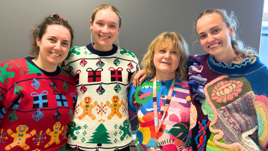 A group of female health workers in ugly jumpers