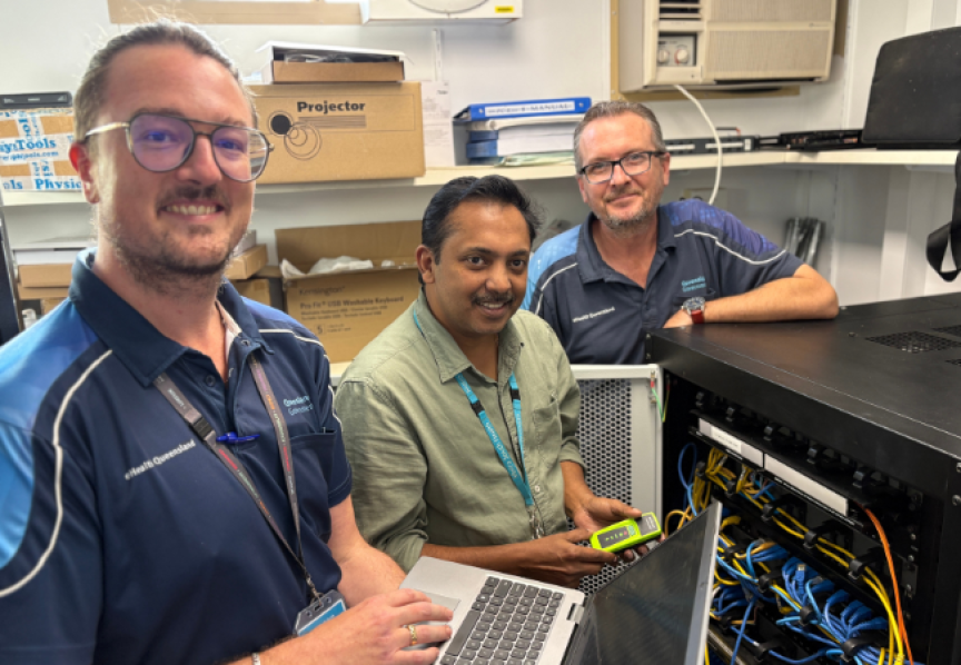 Three male IT staff with equiptment