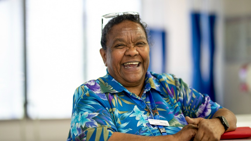 Aboriginal Health Liaison Officer Aunty Glenda Brooks stands at the reception of a PA Hospital ward