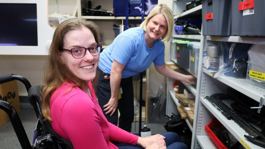A woman in a wheelchair working with a female Occupational Therapist for wheelchair fittings in the clinic