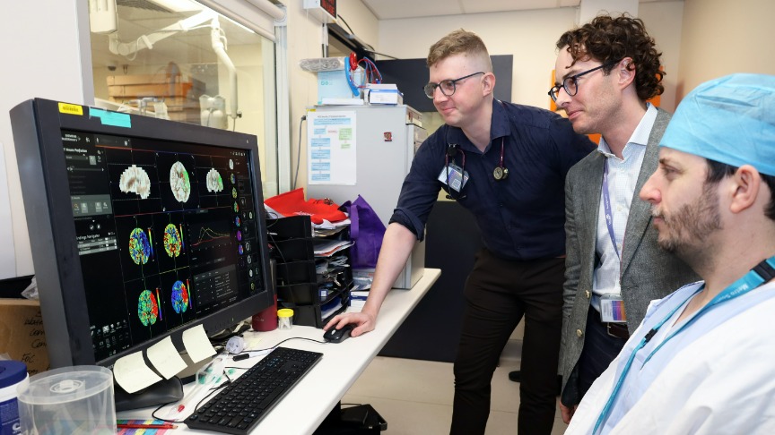 PA Hospital stroke medical team review brain scans on computer screen