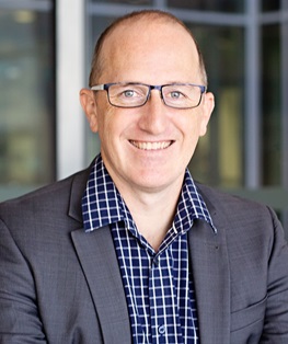 Male speaker at symposium