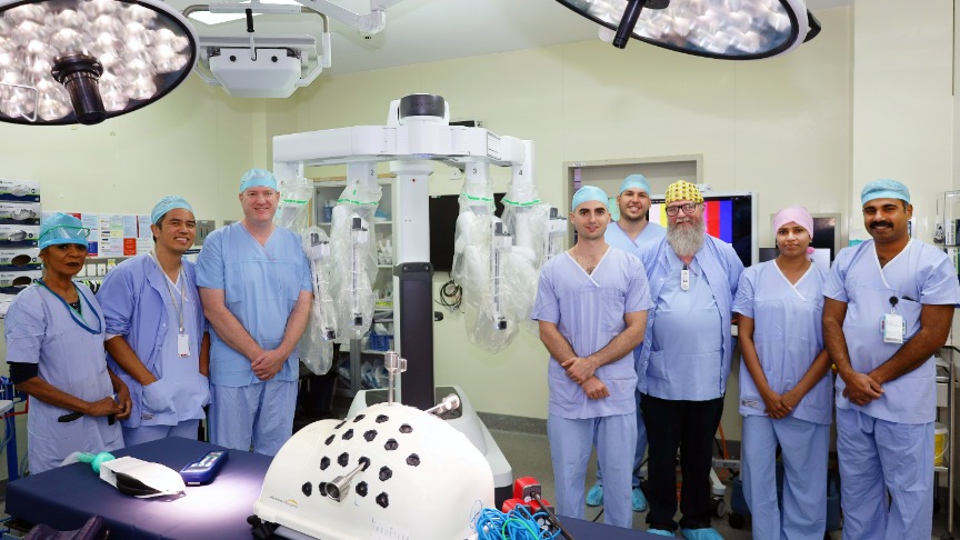 QEII surgical team standing in theatre with da Vinci Xi robot