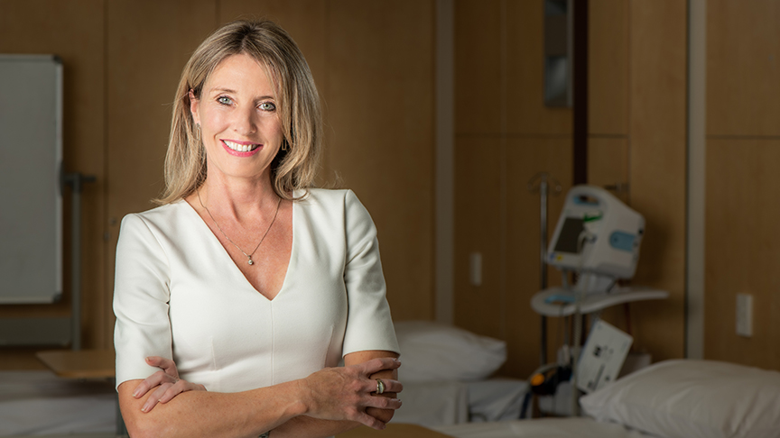 Portrait of Carmel Monaghan standing in a hospital room