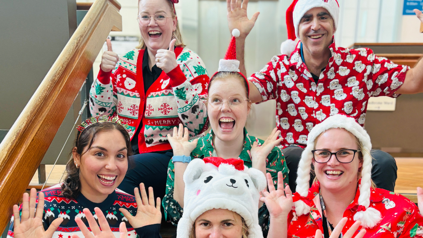 Group of staff in Christmas Outfits