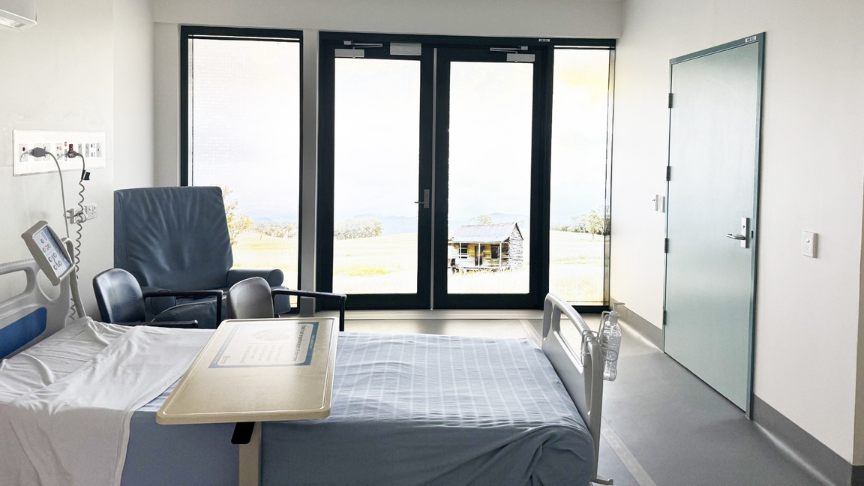 A hospital room with a decal on the window