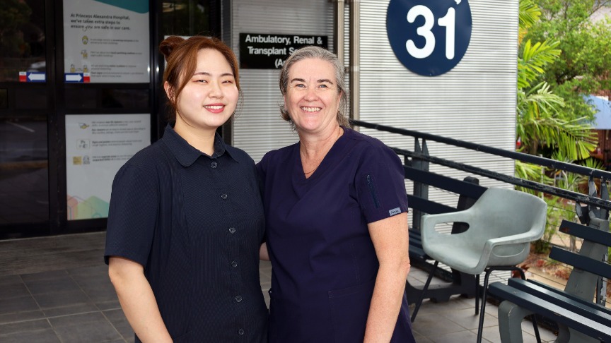 Two female nurses standing outside the Kidney Dialysis Unit at Princess Alexandra Hospital 