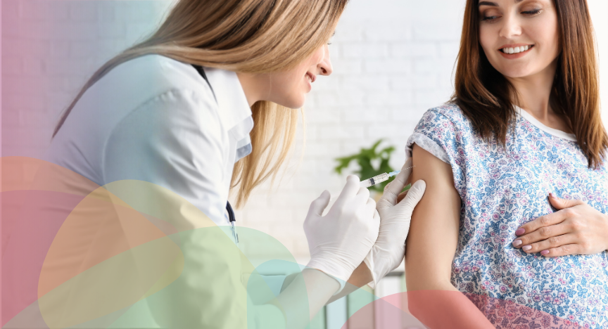 Pregnant woman receiving a vaccination, in a health care setting
