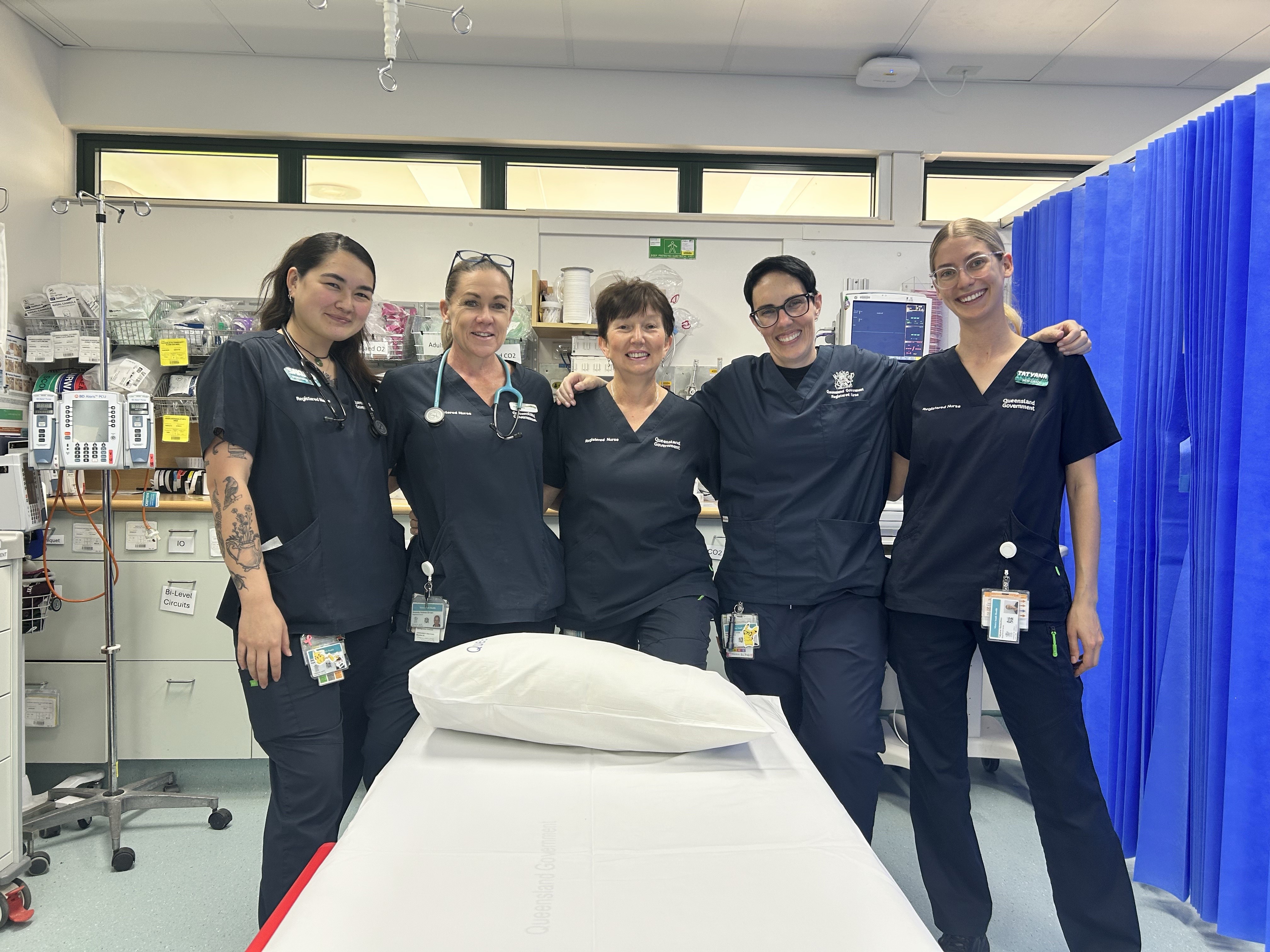 Clinicians standing in a clinical space