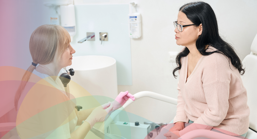 A female doctor talking to a female patient in the doctor's consultation rooms