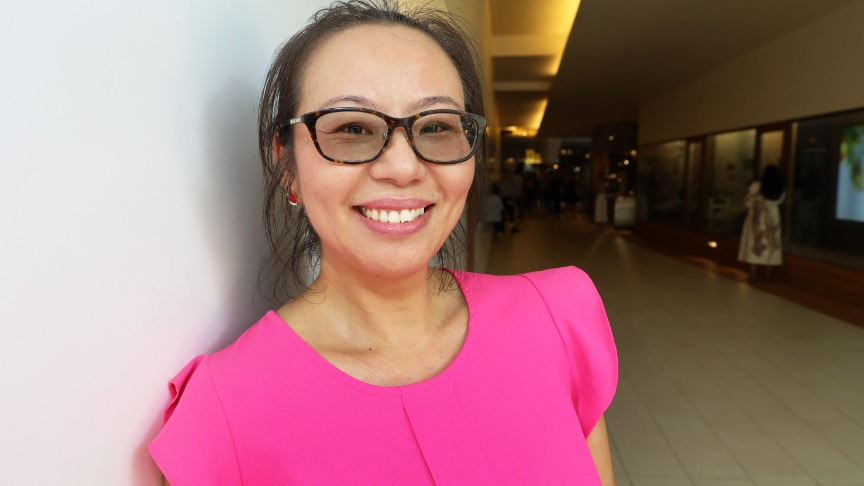 A smiling woman in glasses and a pink shirt, identified as Nurse Practitioner for Diabetes, Jen