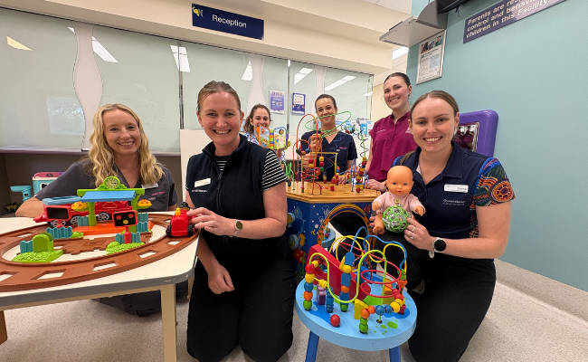 photograph of staff with toys